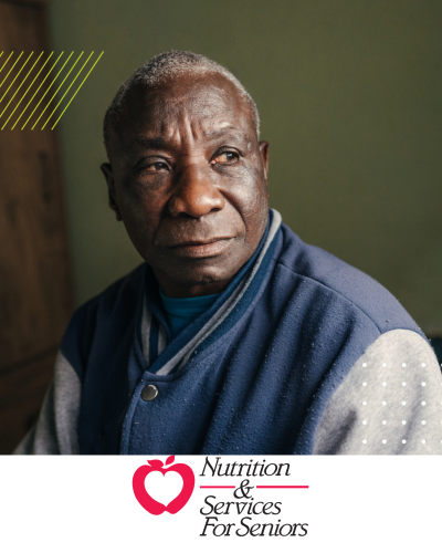 man sitting looking to the left of the camera